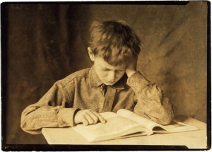 Lewis_Hine,_Boy_studying,_ca__1924